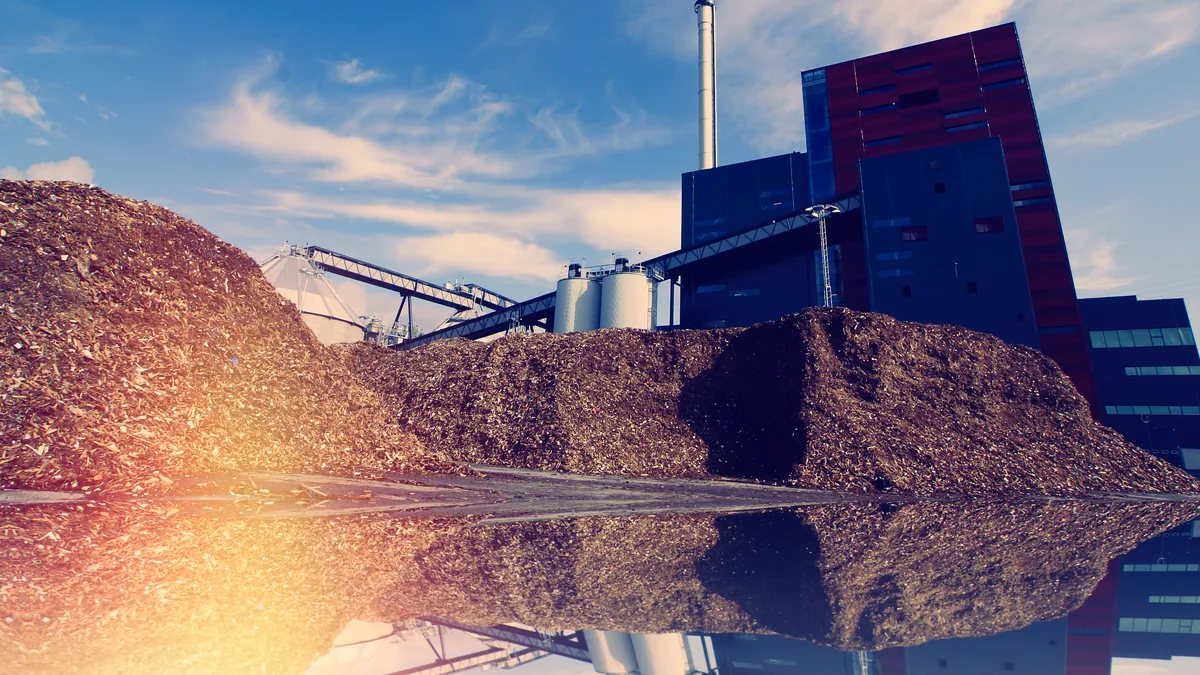 Compost windrow in front of a digestion plant